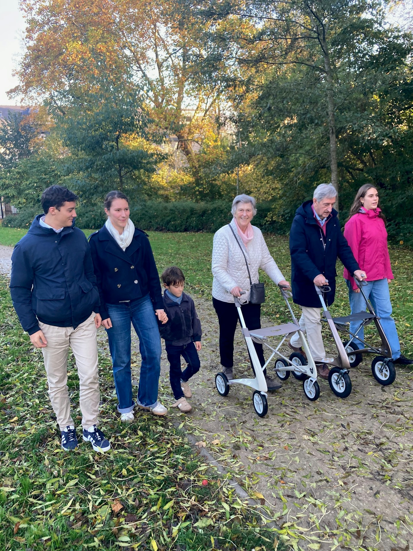 A family walking together in an autumn park