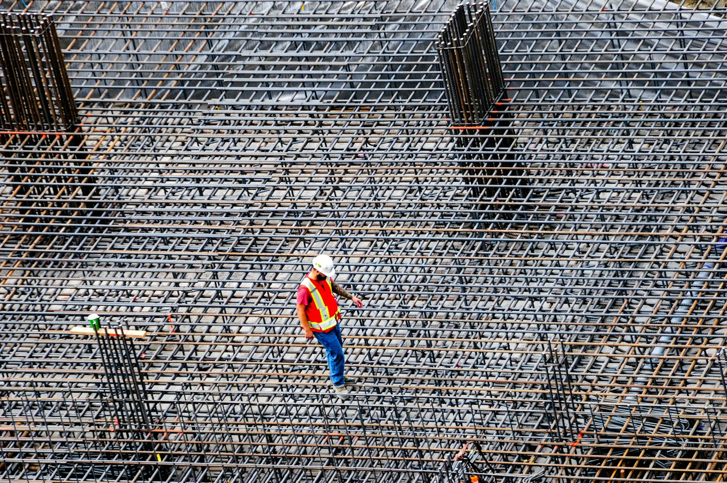 A construction worker inspecting a building site